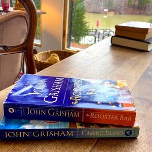 One  John Grisham paperbacks. The Rooster Bar.